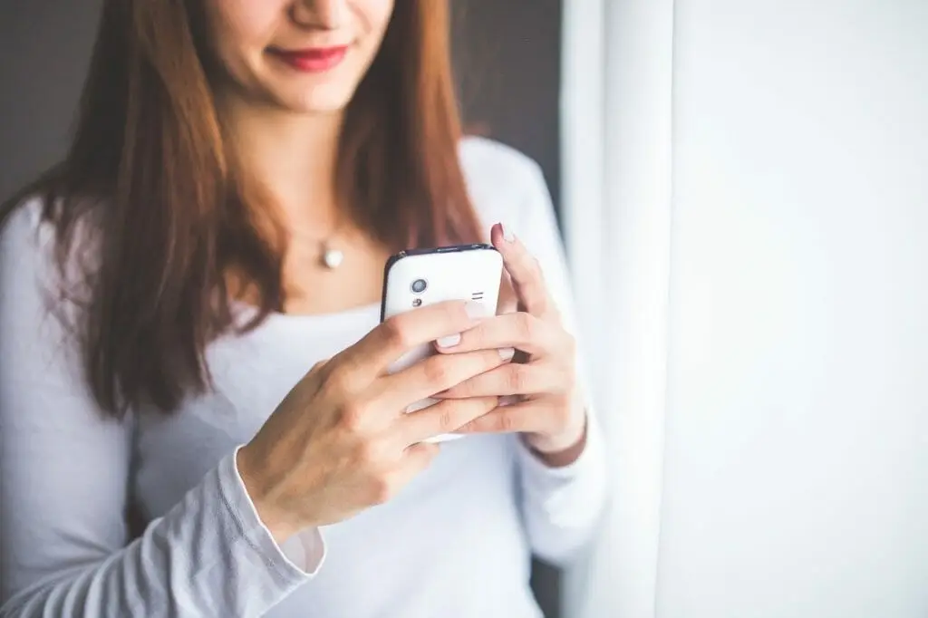 A woman texting on her phone