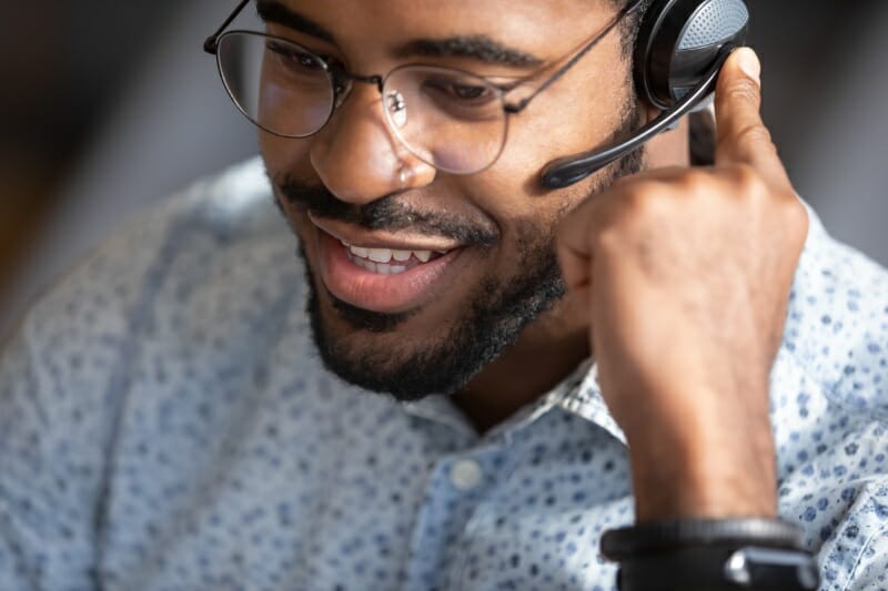Man speaking with a customer on a headset
