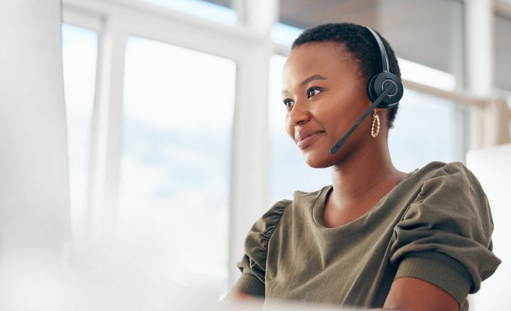 Woman wearing a headset while working.