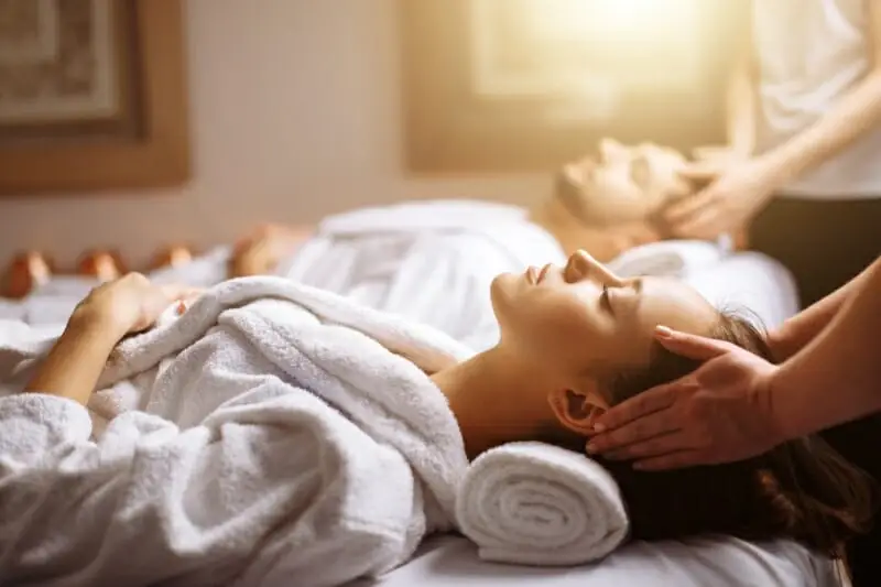 Couple receiving massages.
